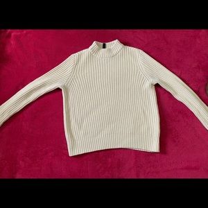 Cream colored turtle-neck sweater